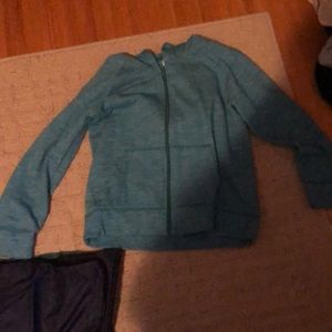 Zip up hoodie, long sleeve with a ty at the bottom